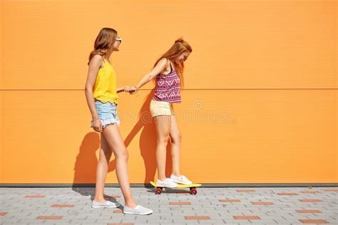 Teenage Girls Riding Skateboard On City Street Stock Image Image Of
