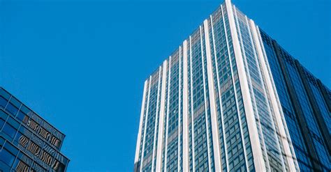Glass Skyscrapers Under Cloudless Bright Blue Sky · Free Stock Photo