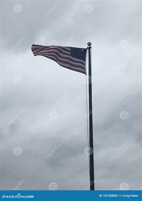 American Flag Blowing In The Wind Stock Image Image Of Flag Cloudy