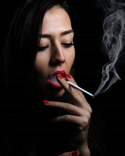 Portrait Of The Beautiful Elegant Girl Smoking Cigarette On Black Background Poster By Ivan Dragiev