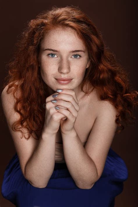 Smiling Beautiful Redhead Woman Posing For Studio Shot Stock Image
