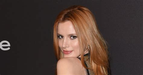 Bella Thorne Flashes Her Cleavage As She Gets Septum Piercing To