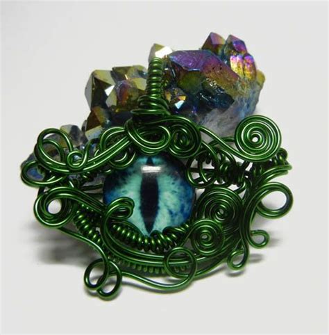 On Sale Taxidermy Glass Eye Pendant Green Wire Wrap Blue Etsy Glass Eyeballs Jewelery