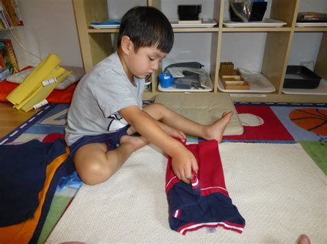 Family FECS: Montessori Activity: Folding Clothes