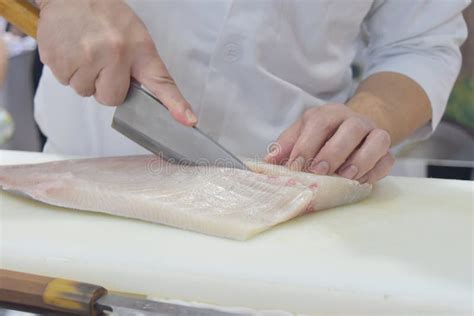 Chef Preparing By Use Knife Slicing Raw Fresh On Cutting Board Stock