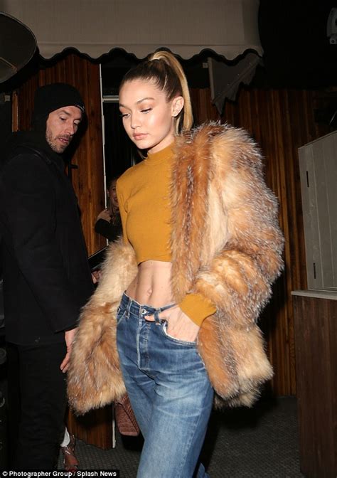 Gigi Hadid Shows Off Her Impeccable Abs In A Bold Mustard Crop Top In