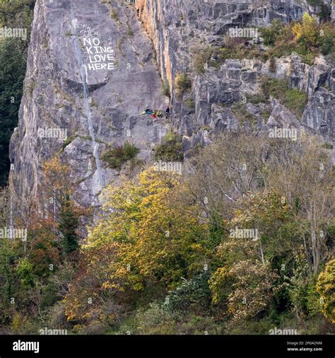 Climbers Rest On A Ledge On A Cliff Face In Bristol S Avon Gorge Stock