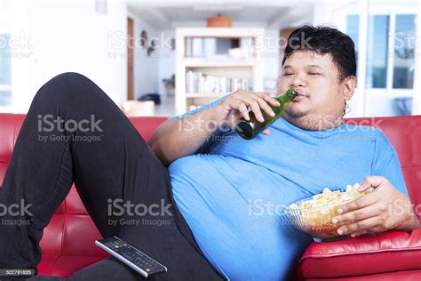 Fat Man Drinking Beer And Eat Snack Stock Photo Download Image Now