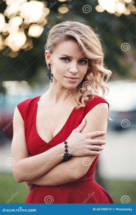 Beautiful Young Blonde Model In A Red Dress Posing Stock Photo Image