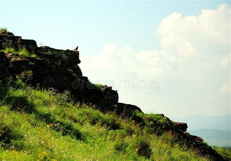 The Slope Of A High Mountain With The Remains Of Ancient Buildings