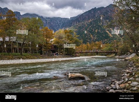 Kamikochi River And Tourists Visiting The Kamikochi Valley To Admire