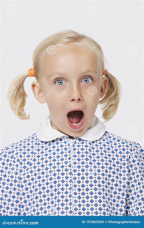 Portrait Of Surprised Happy Teenage Girl In Hoodie Opening T Box And