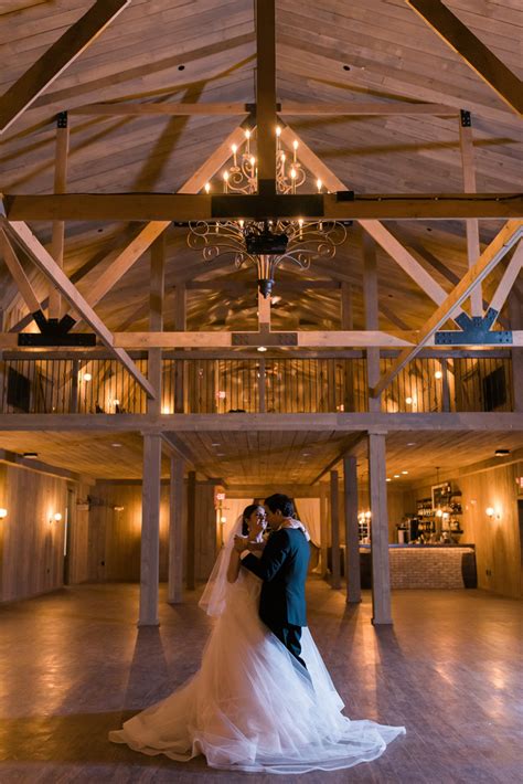 The white barn's rustic charm is breathtaking in its idyllic natural setting amidst impressive oaks and lush gardens. Rustic Manor Wedding - The Majestic Vision