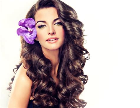 beautiful girl with long curly brown hair flower in hair 8k ultra hd wallpaper background