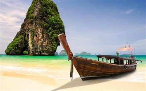 Long Boat And Rocks On Railay Beach In Krabi Thailand E107562