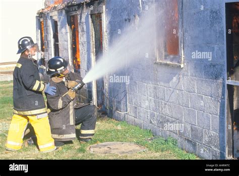 Firemen Putting Out A House On Fire West Virginia Stock Photo Alamy