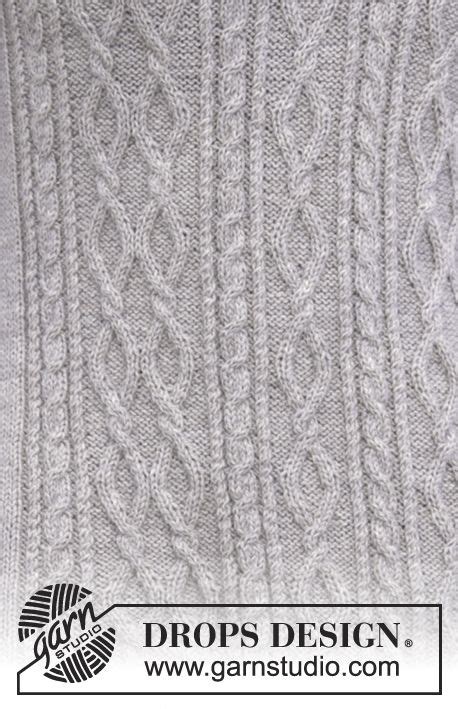 An Image Of A White Sweater That Is Knitted With Cablework And Has The