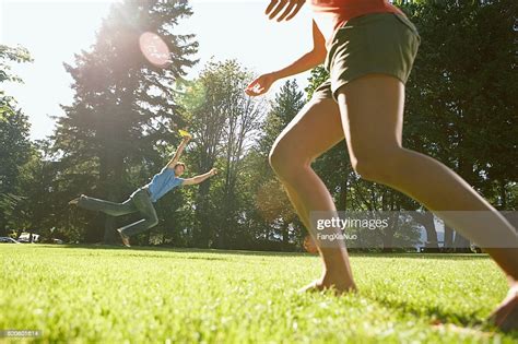 Couple Playing Frisbee Photo Getty Images