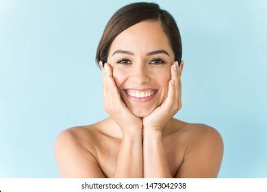 Smiling Beautiful Woman Rubbing Face Hands Stock Photo