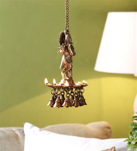 Buy Yellow Brass Krishna Hanging Diya By Handecor Online Diyas