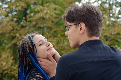 A Manand X27 S Hand Adjusts The Blue Braids In The Womanand X27 S Hair Long B Stock Image Image