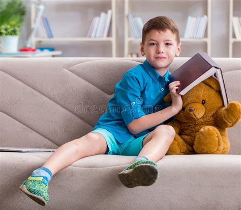 Small Boy Reading Books At Home Stock Image Image Of Bear Adorable