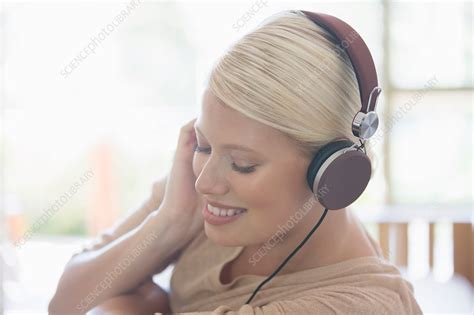 Woman Listening To Headphones Stock Image F0148316 Science Photo