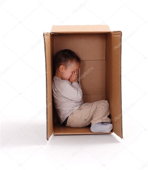 Sad Little Boy Hiding In Cardboard Box — Stock Photo © Erierika 8002782
