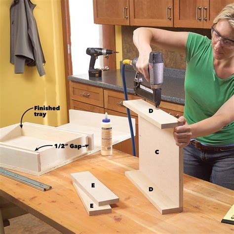 The finished diy pull out shelves optimize the space in the kitchen cabinets. How to Build Pull Out Under Sink Storage Trays for Your ...