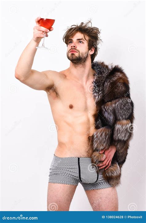 Guy Attractive Posing Fur Coat On Naked Body Sleepy Macho Tousled Hair Drink Wine Or Alcohol