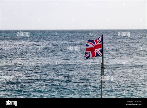 British Flag On Sea Background In Gibraltar British Territory In Europe
