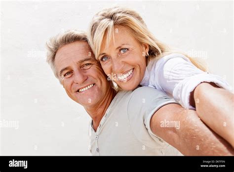 Mature Couple Smiling And Embracing Stock Photo Alamy