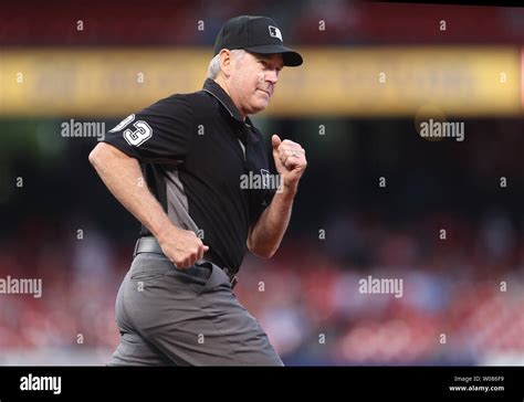 Major League Umpire Crew Chief Mike Winters Runs To First Base For The