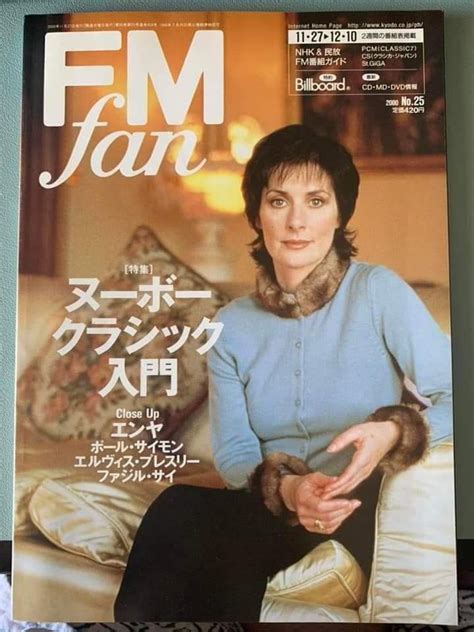 A Magazine With An Image Of A Woman Holding A Cat