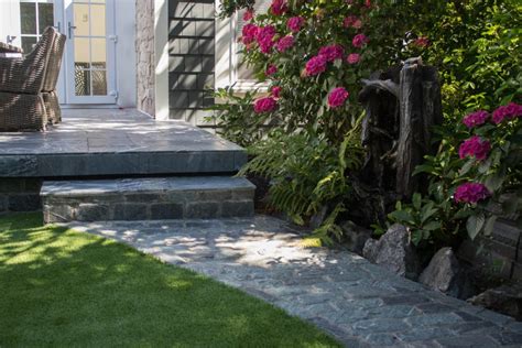 Slate floor tiles come in a range of earth tone colors that add a rustic touch to the patio or interior of your home. Slate Walkway Outdoor Landscaping - K2 Stone