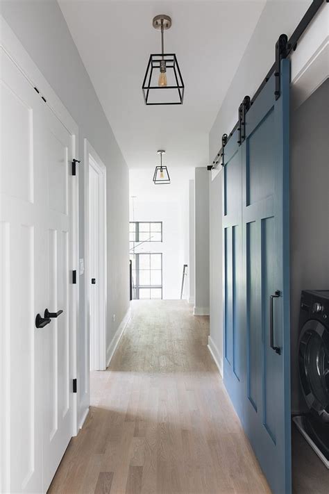 Mixing the modern interior design and a rustic accent in a barn doors can be repurposed, recycled and handmade. Blue barn door Laundry room with blue grey barn door Barn ...