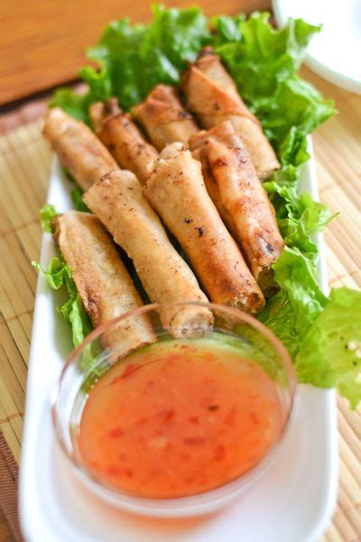 Roll wrappers around the mixture, folding edges inward to close. Lumpiang Shanghai (Filipino Pork Spring Roll) | Recipe ...