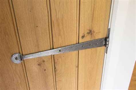 Up to the 17th century for a country cottage or rustic style in your home, t hinges fitted on oak ledge and brace doors. Penny Pewter T Hinges in 2020 | T hinges, Traditional ...