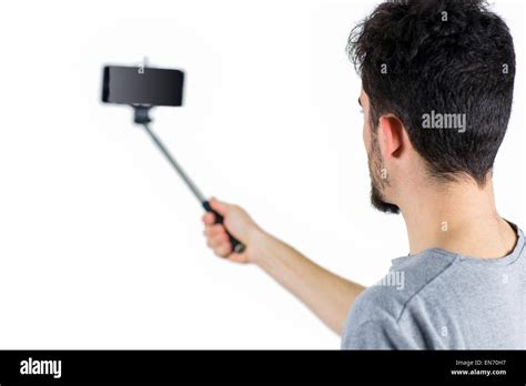 Casual Man Using A Selfie Stick Stock Photo Alamy
