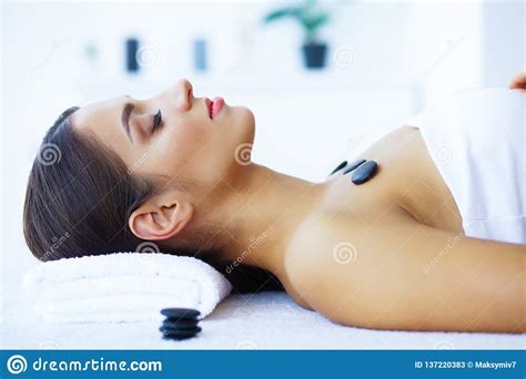 Beauty And Care Woman In Spa Salon Young Girl Lying On Massage Tables