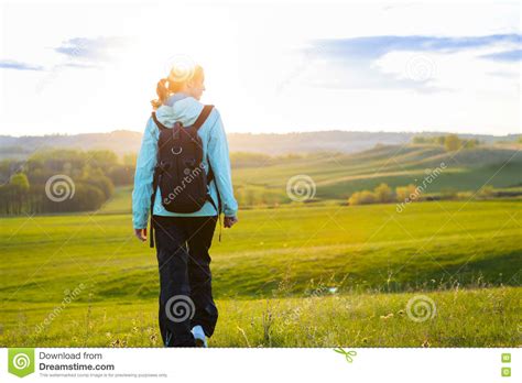 Fresh And Healthy Female Model During Hike Outdoors In Field Stock