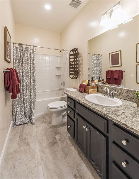 Maybe you would like to learn more about one of these? Dark cabinet with granite countertop bathroom design ...