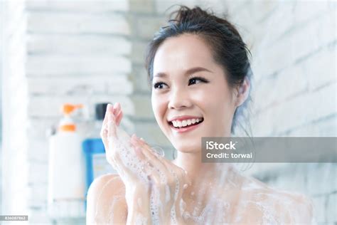 Asian Women Are Taking A Shower In The Bathroom She Is Rubbing Soapshe