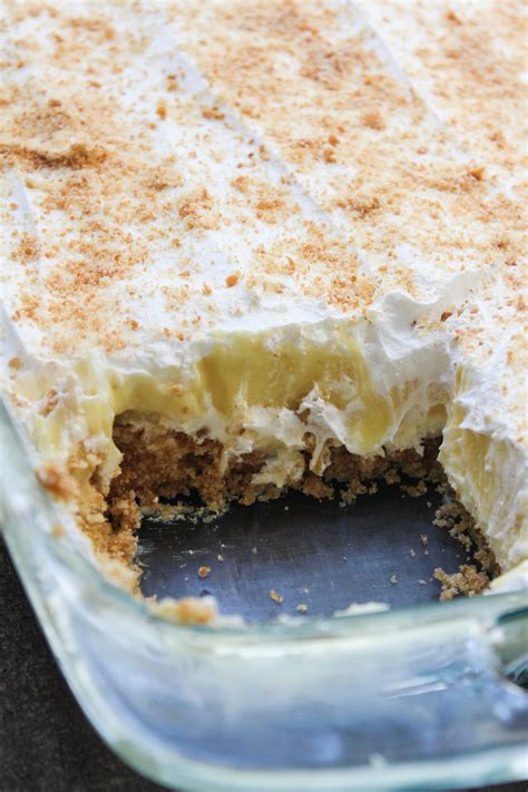Chocolate delight is a popular dessert made with layers of pudding, sweetened cream cheese, and whipped topping on a graham cracker crust. No Bake Banana Pudding Layer Dessert 2 - High Heels and Grills