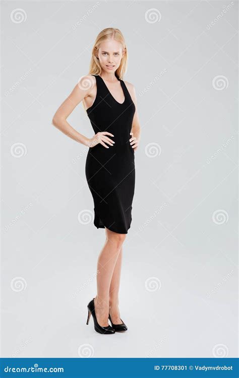 Beautiful Woman Posing In Black Dress With Hands On Hips Stock Image