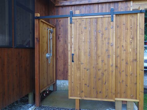 our outdoor shower is done we love the sliding door outdoor shower outdoor shower diy