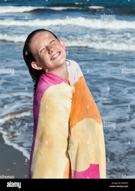 Cute Young Girl Drying Off With A Beach Towel Stock Photo Alamy