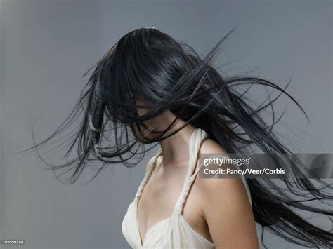 Woman With Long Flowing Black Hair High Res Stock Photo Getty Images