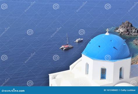 Beautiful Blue Domed And White Buildings In Santorini Greece Stock
