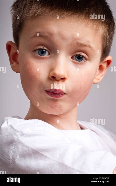 Little Boy With Pouting Facial Expression Stock Photo Alamy